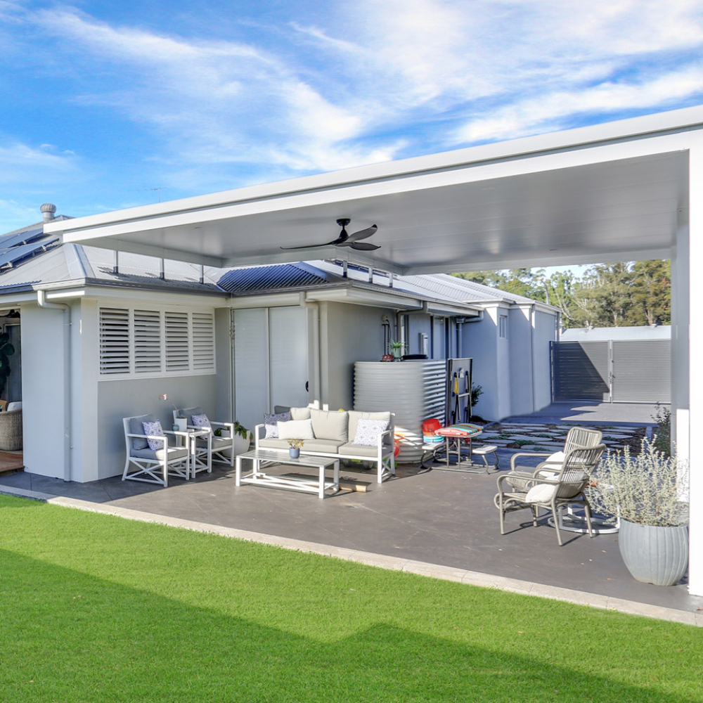DIY attached flyover flat roof patio/pergola area with comfortable furniture