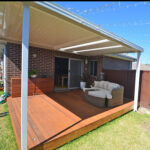 Stylish outdoor DIY attached flat roof pergola/patio with seating