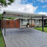 Modern diy freestanding flat roof carport in front of suburban Australian home.
