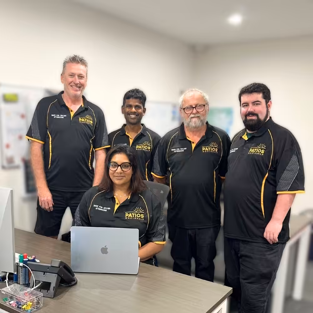 Patios Wholesale team in office with laptop