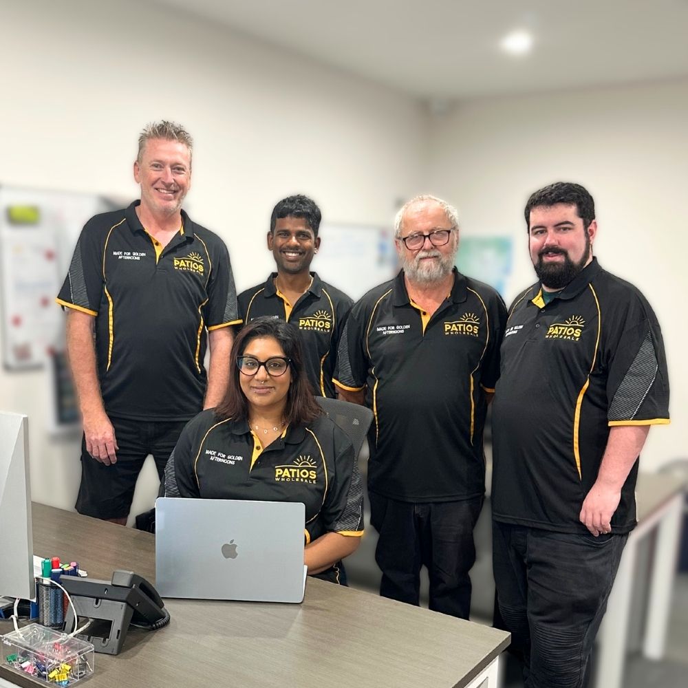 Team of five at Patios Specialists office.